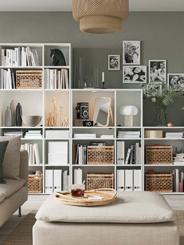 VIHALS shelving combination against a green wall in a living room