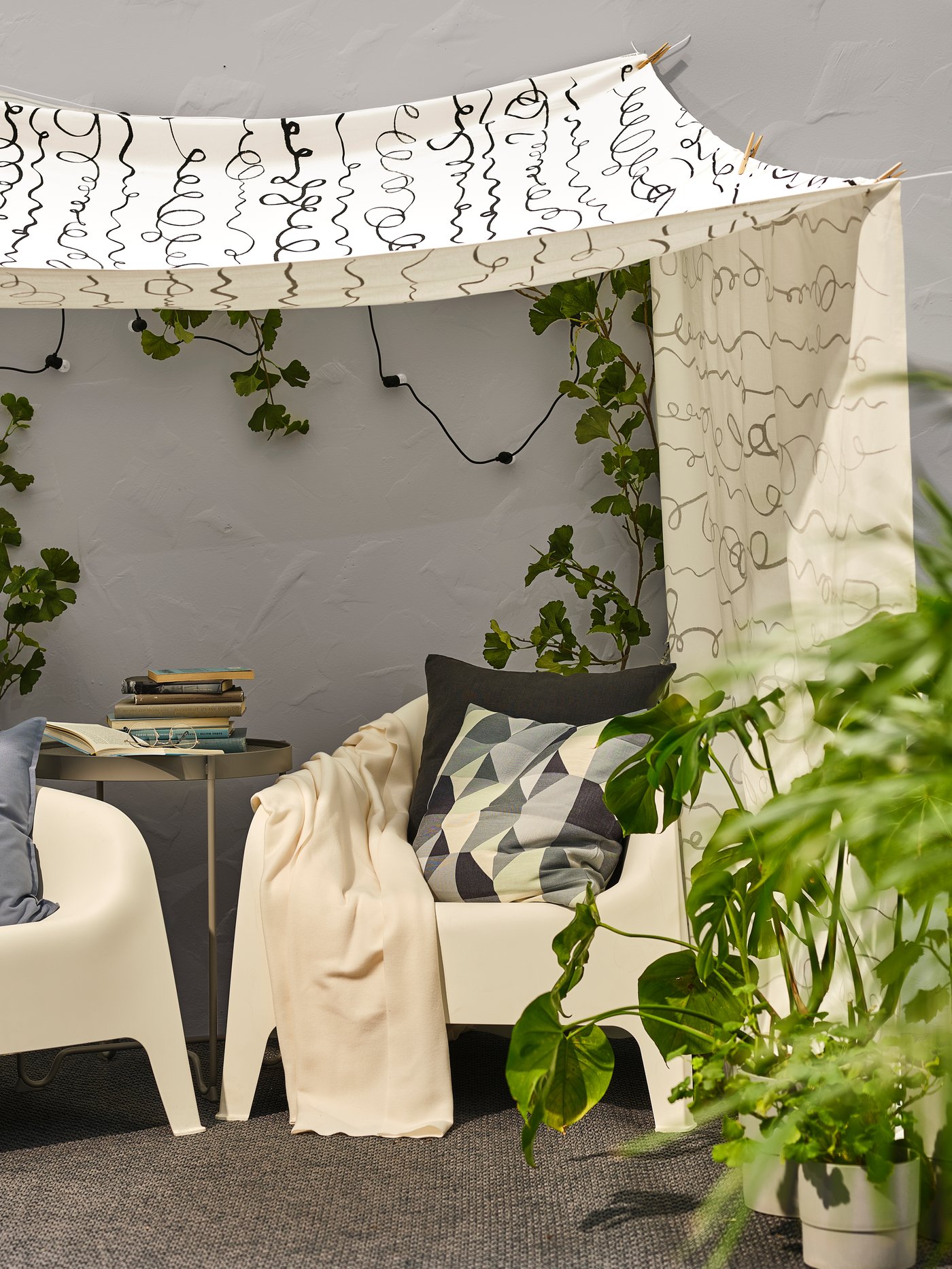 A white SKARPÖ armchair, outdoor