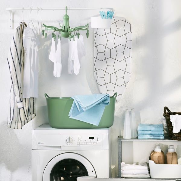 A green TORKIS flexi laundry basket, in-/outdoor