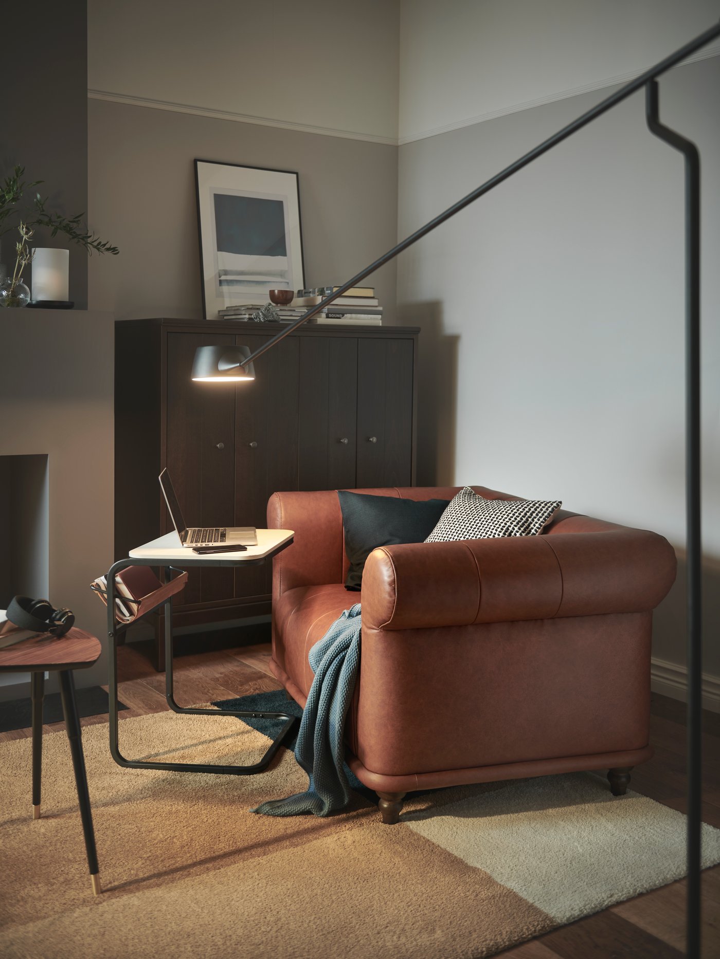 A brown leather sofa in the living room.