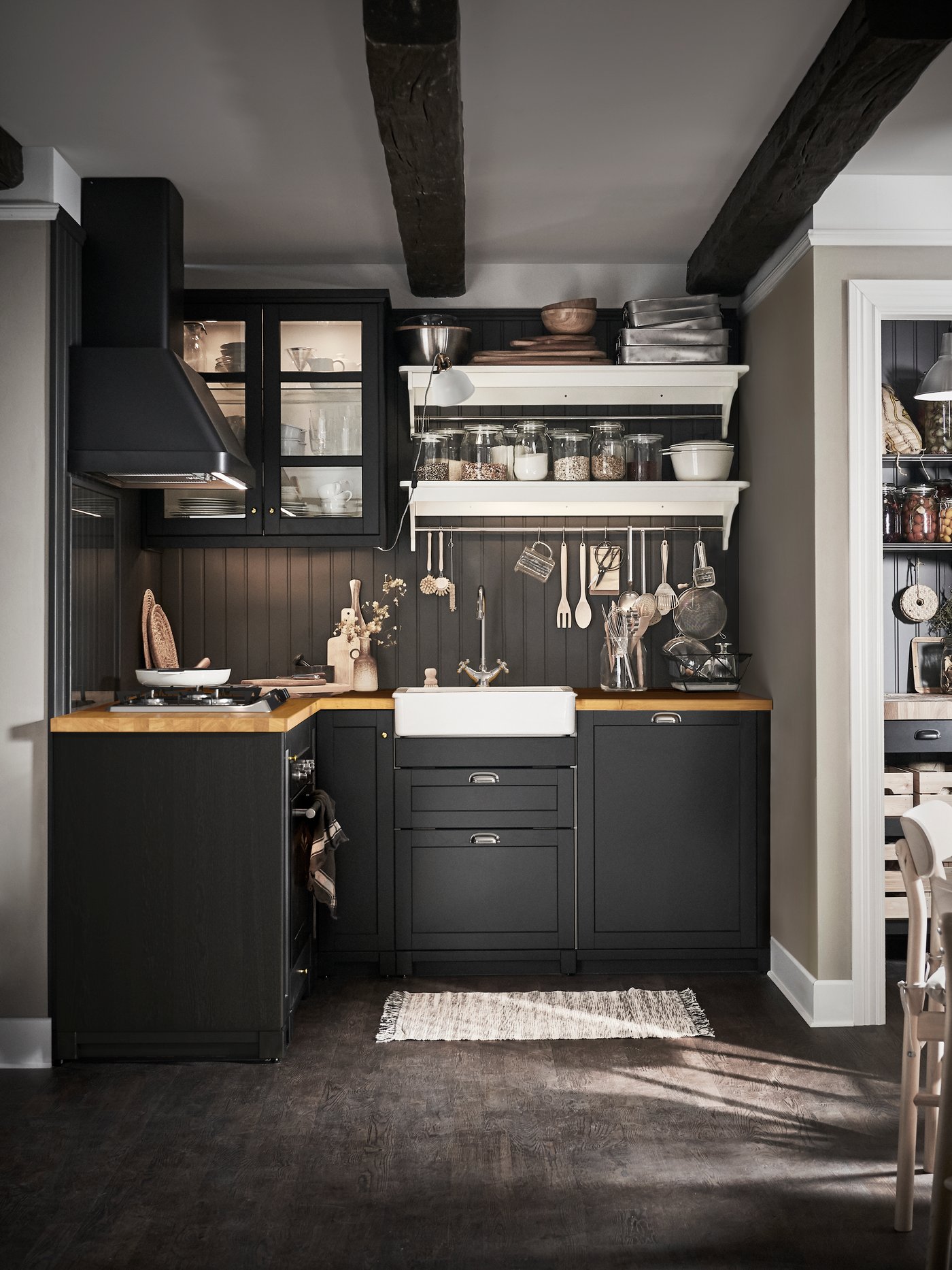 A black FOKUSERA wall mounted extractor hood in the kitchen