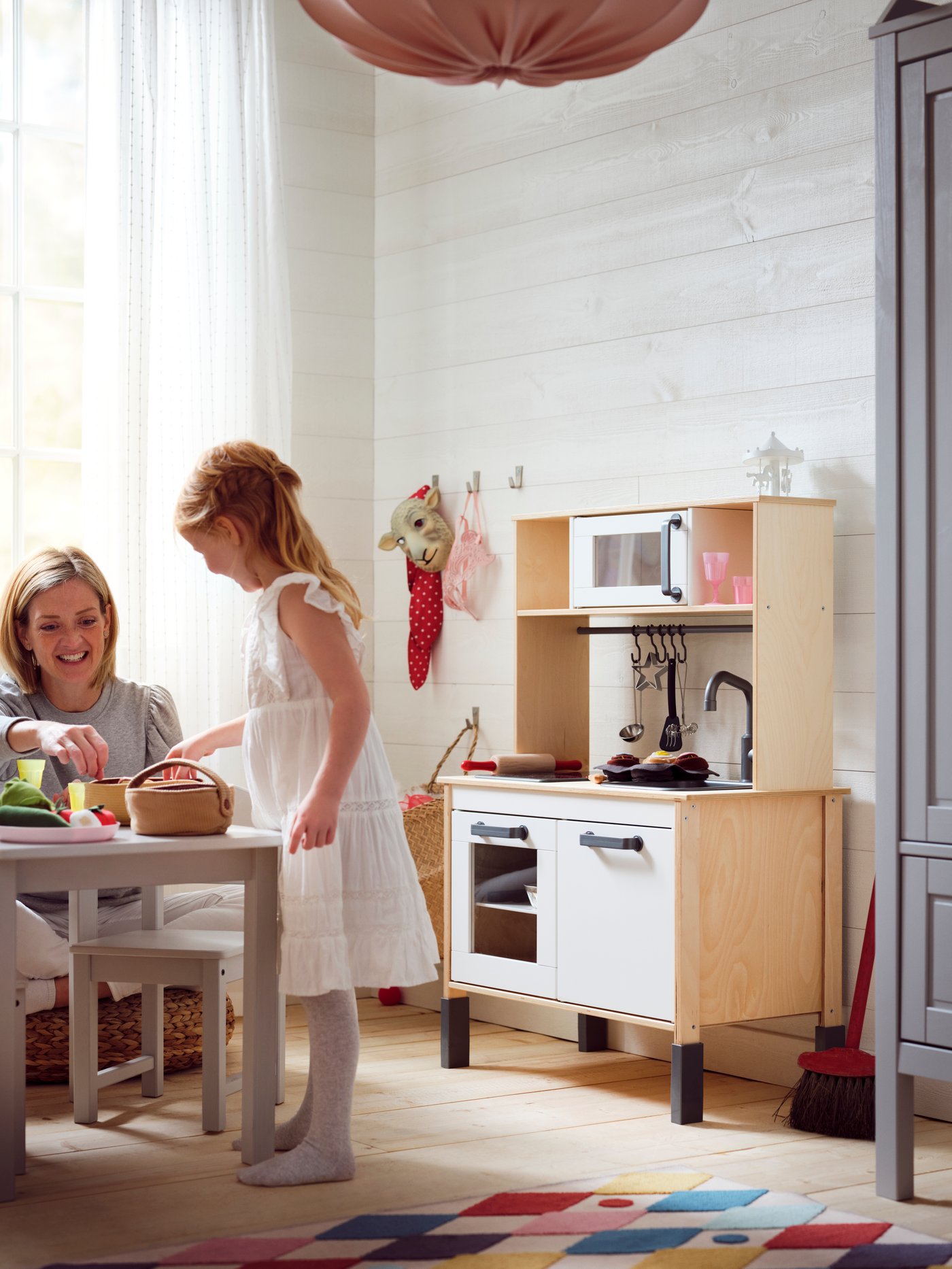 A birch DUKTIG play kitchen in the childrens room