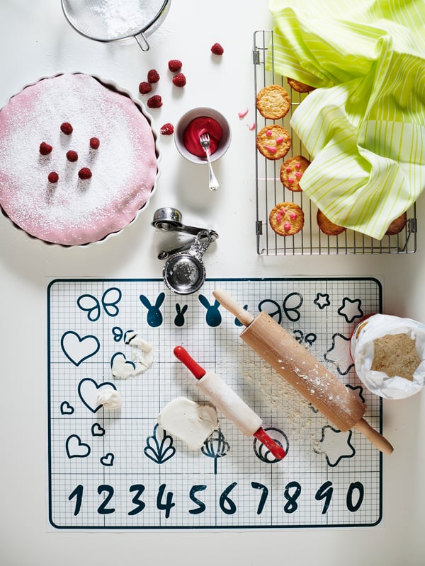 A DUKTIG 7-piece toy baking set in the childrens room