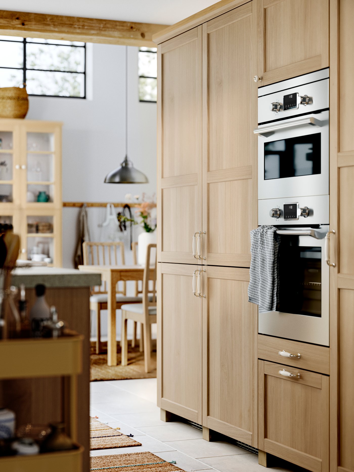 A pewter effect ANKARSPEL pendant lamp in the kitchen