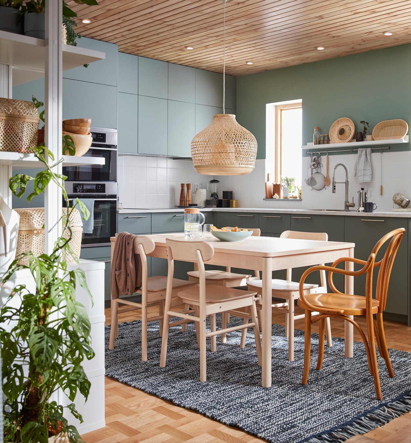 A birch wood dinner table and four chairs from the RÖNNINGE series, plus an IKEA chair from the 60’s.