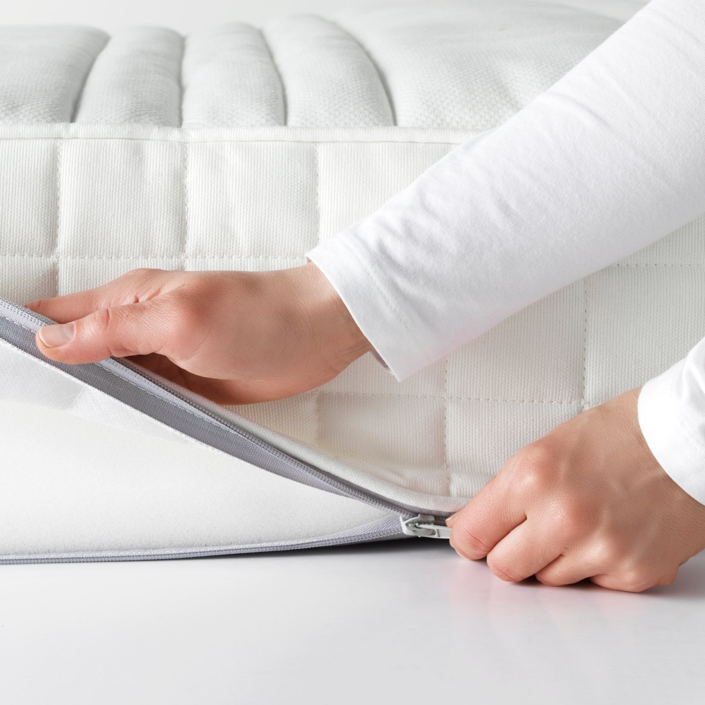 A firm/white MATRAND memory foam mattress