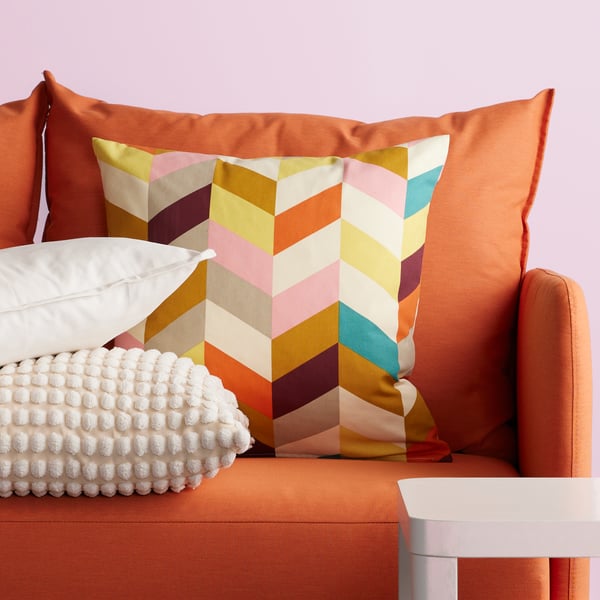 A white GURLI cushion cover in the living room