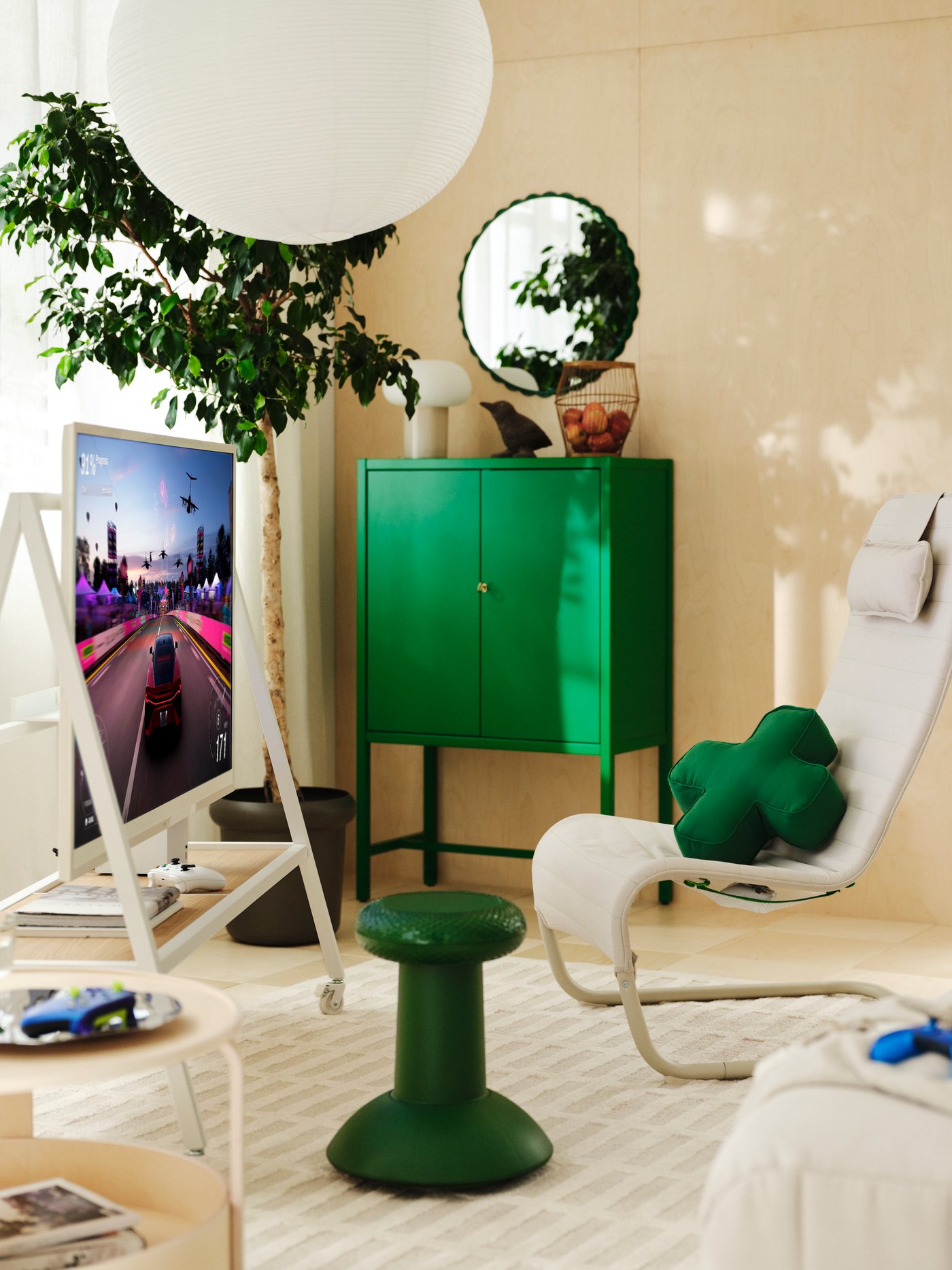 A white YXSTABY gaming tv stand on castors in the living room