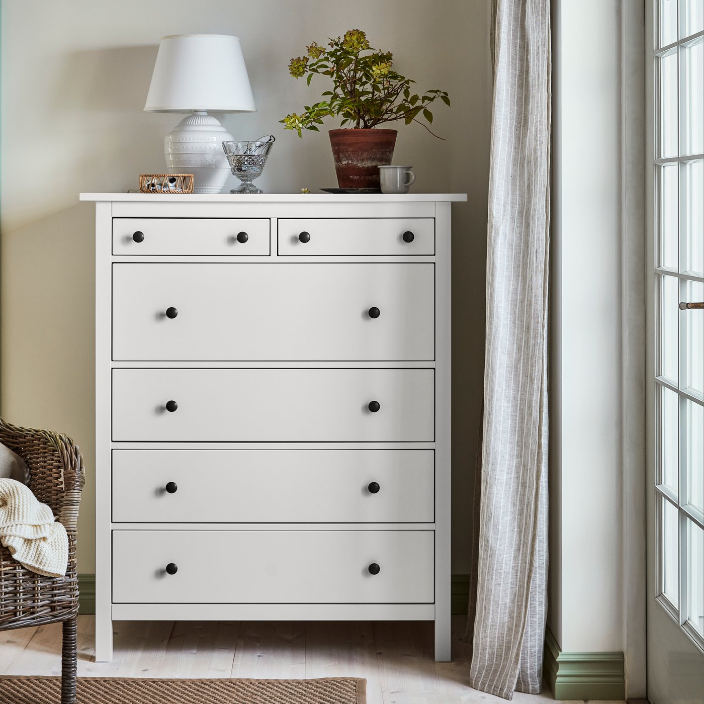 A white HEMNES chest of 6 drawers in the bedroom