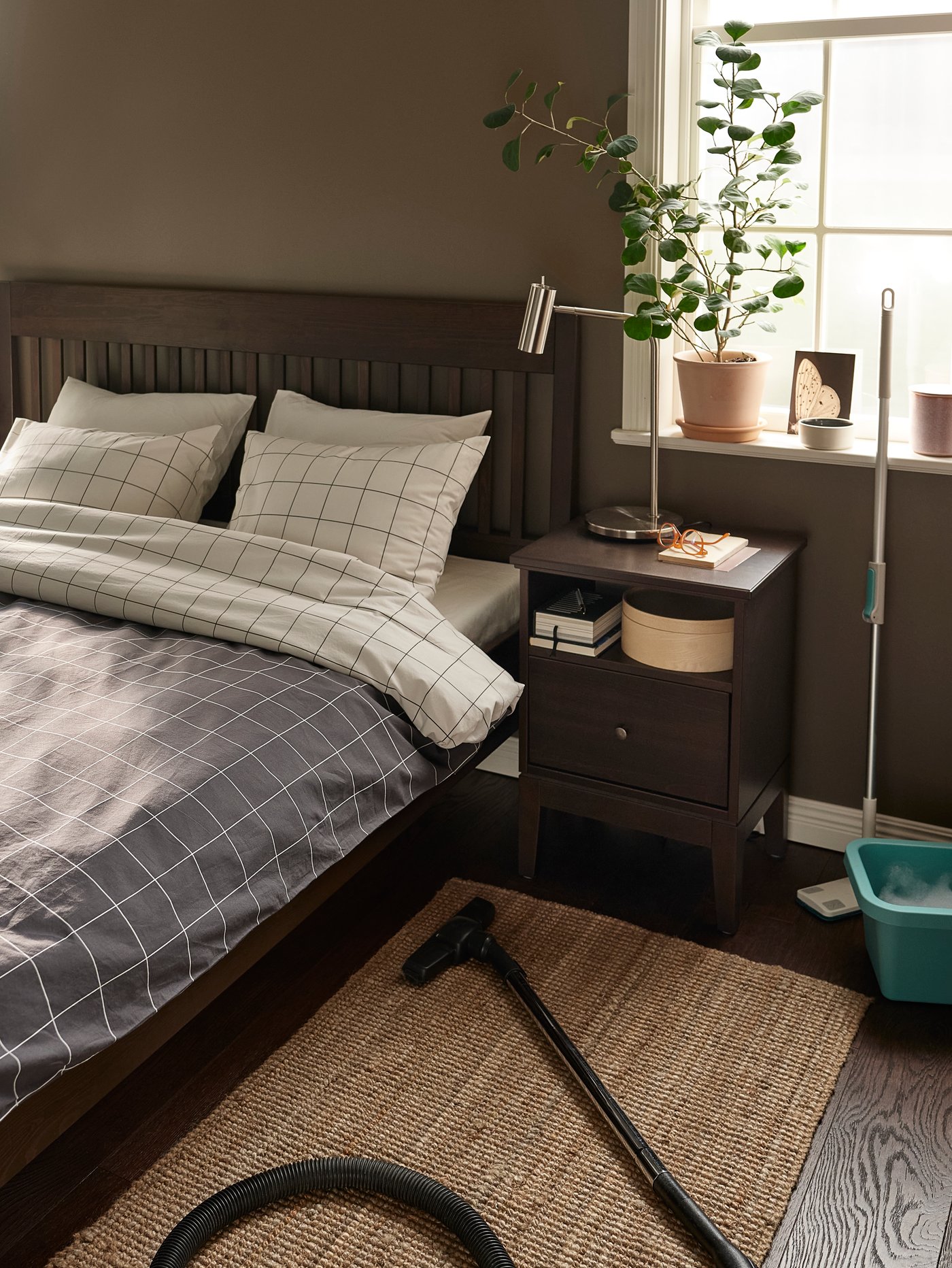 A dark brown stained IDANÄS bedside table