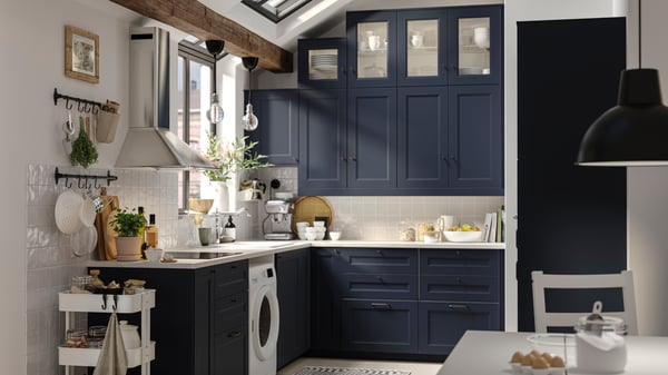 An IKEA AXSTAD blue L-shaped kitchen