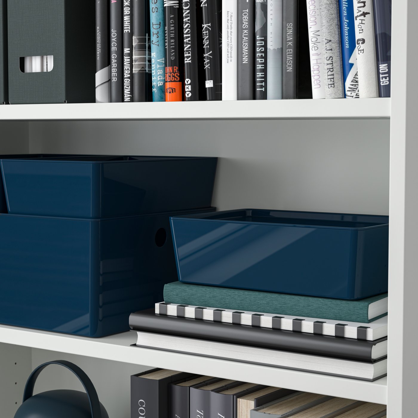 A black-blue KUGGIS box with lid in the living room