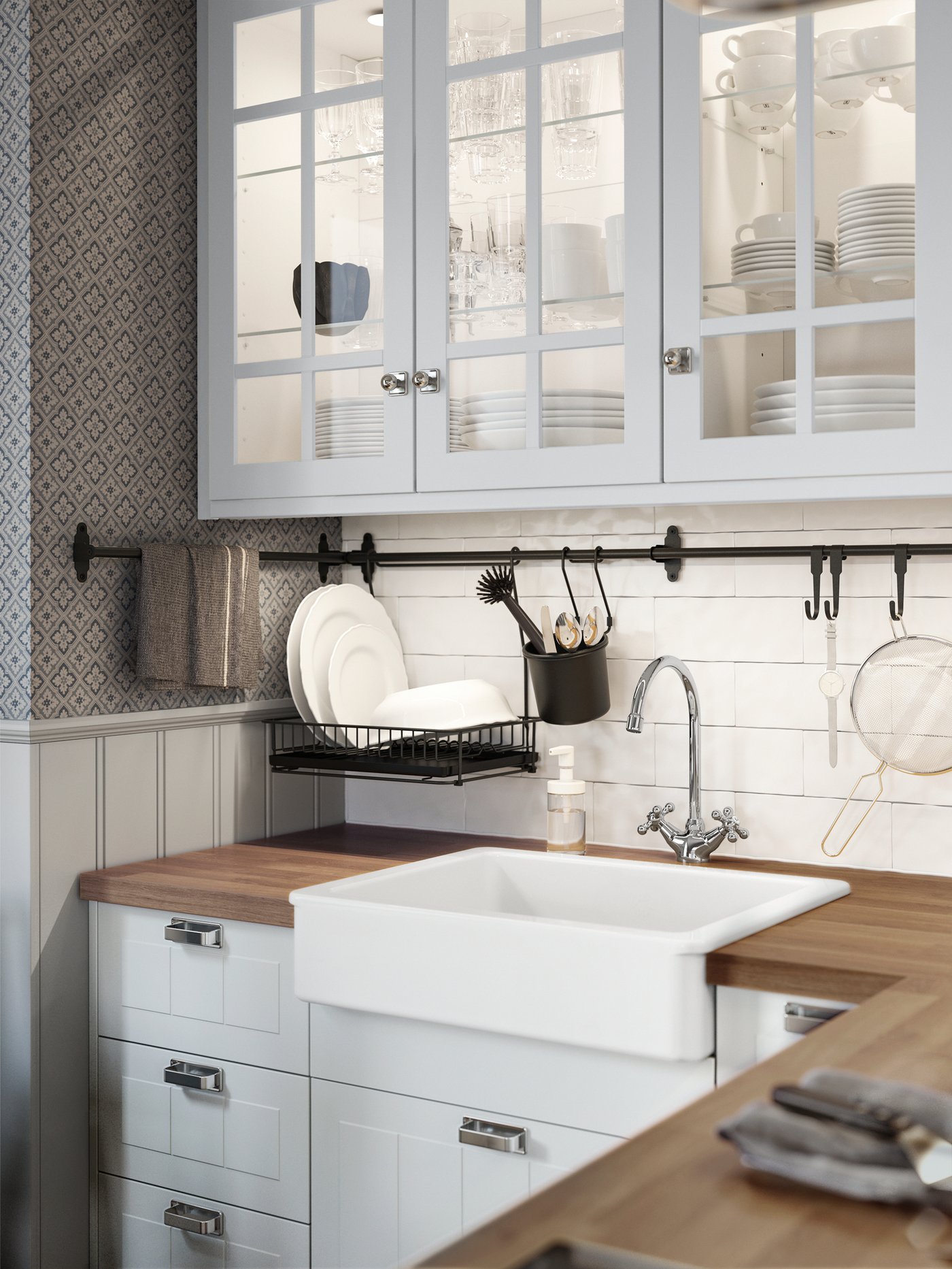 A chrome-plated EDSVIK dual-control kitchen mixer tap in the kitchen