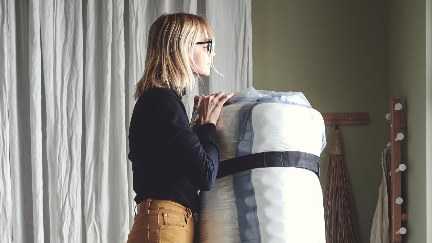 A medium firm/light blue VESTERÖY pocket sprung mattress