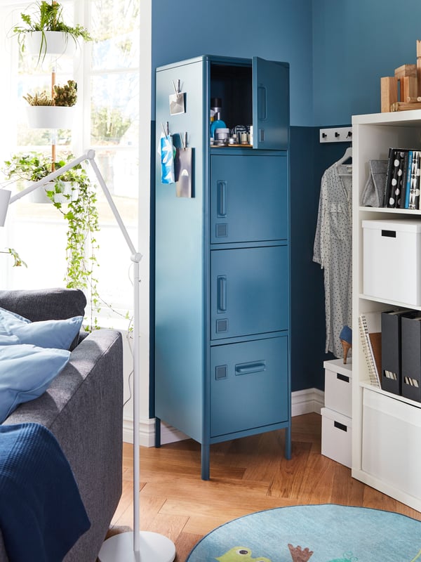 Next to a window is a narrow wall where IDÅSEN high cabinet with four doors fits perfectly since it’s narrow too.