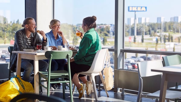 Friends having breakfast at an IKEA restaurant.