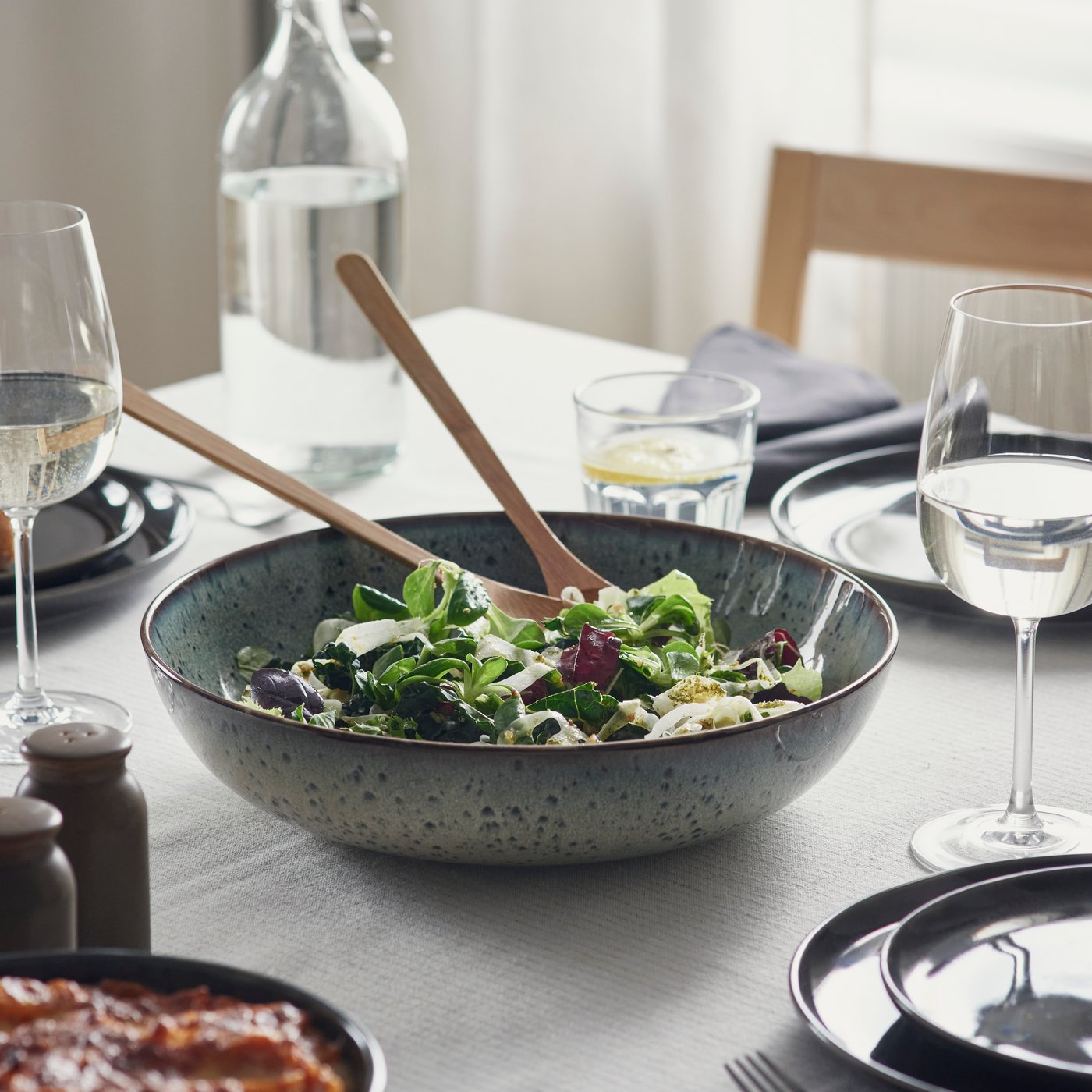 A beige-green GLADELIG serving bowl