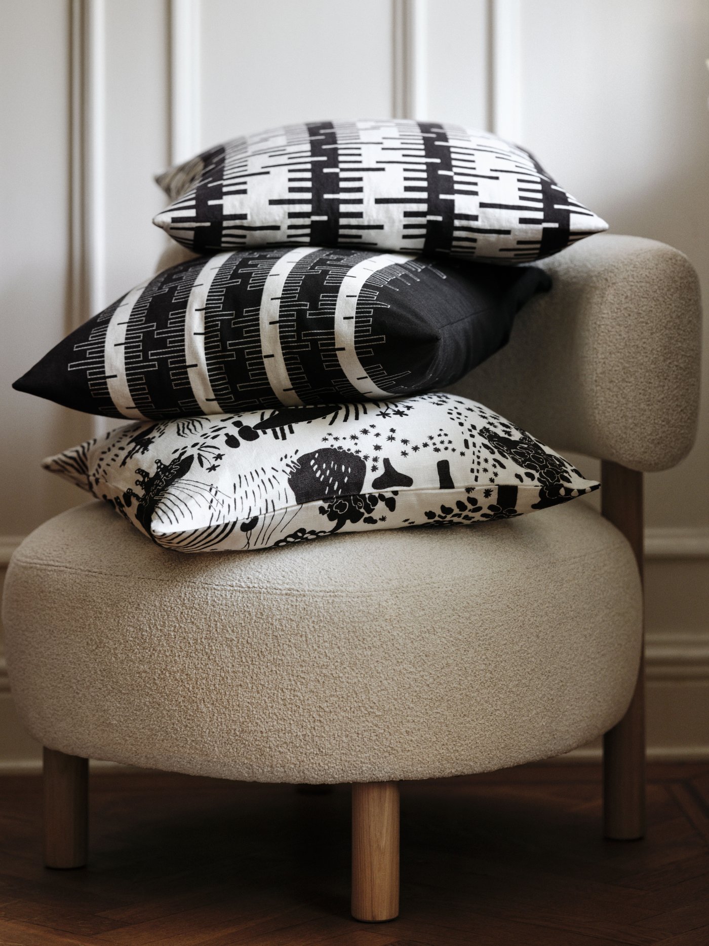 A black/off-white STOCKHOLM 2025 cushion cover