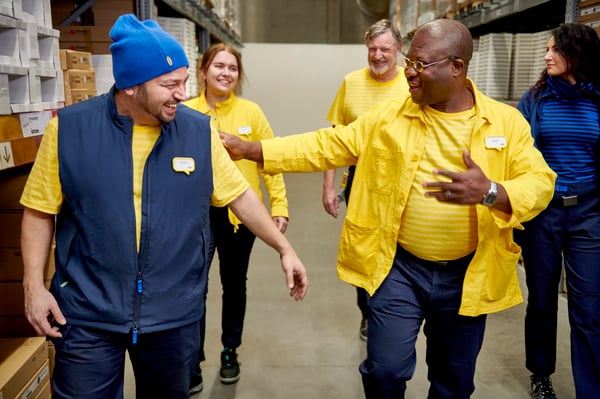 IKEA co-workers smiling to each other and complimenting each other