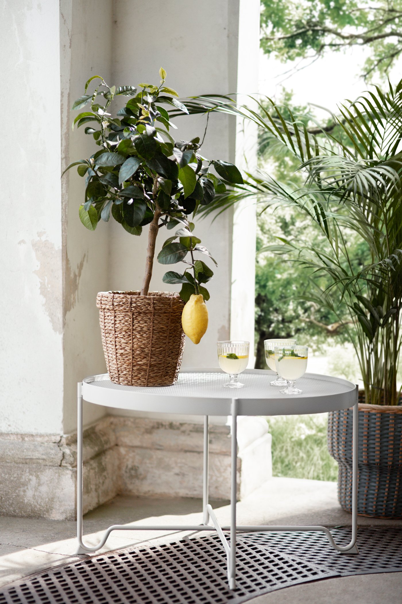 A beige KROKHOLMEN coffee table, outdoor