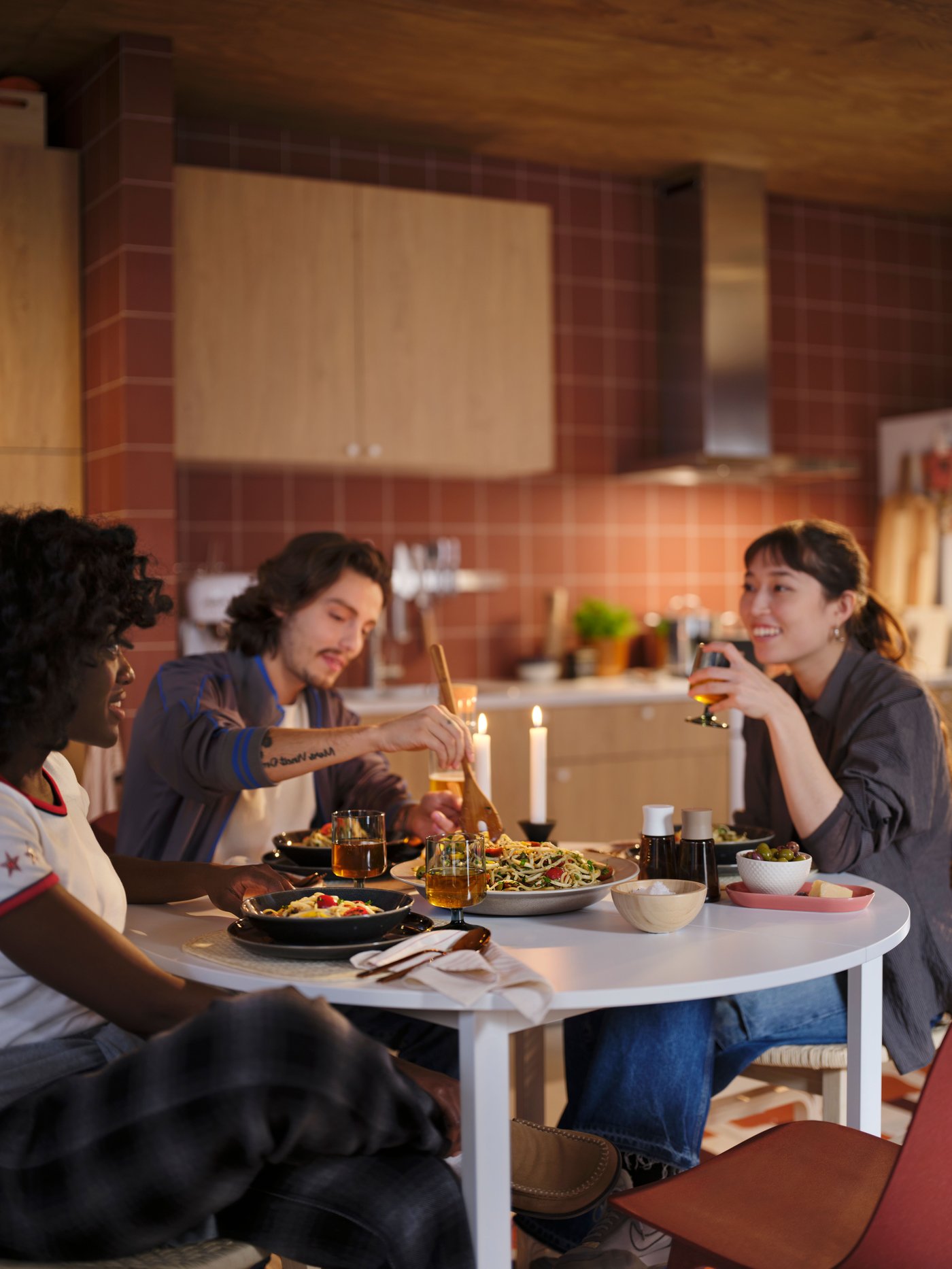 A red ODGER chair in the kitchen