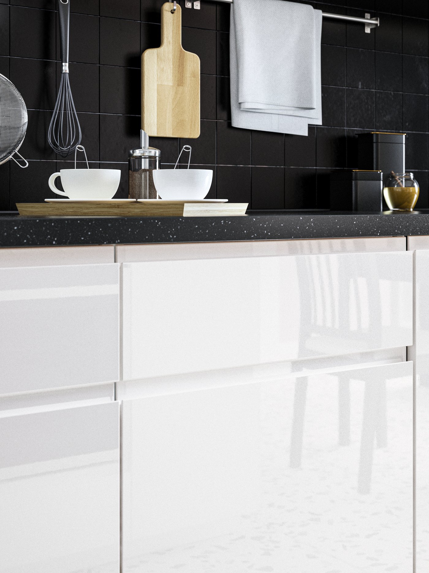 A high-gloss white VOXTORP drawer front