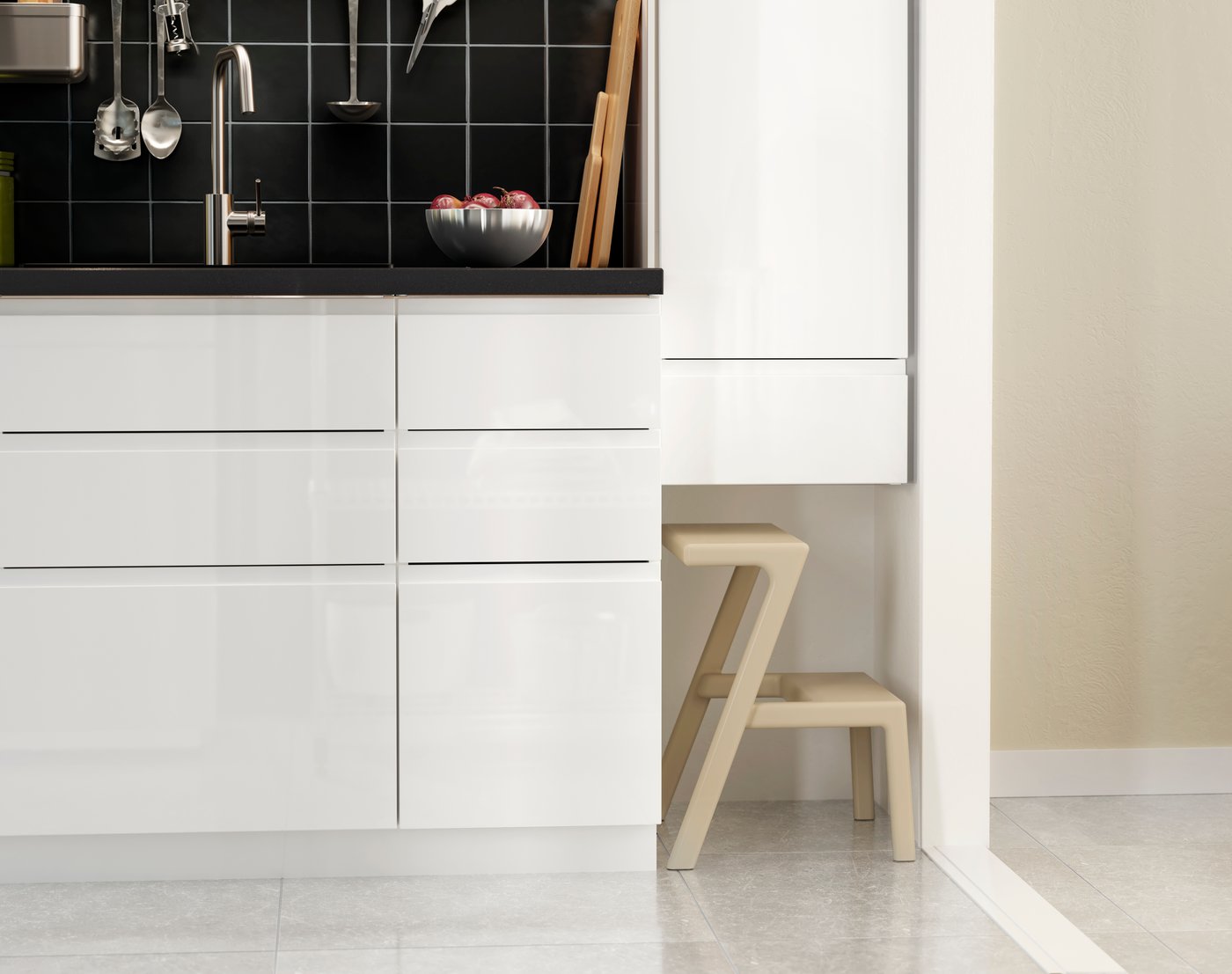A white Maximera/Voxtorp high-gloss/white METOD base cabinet with 3 drawers