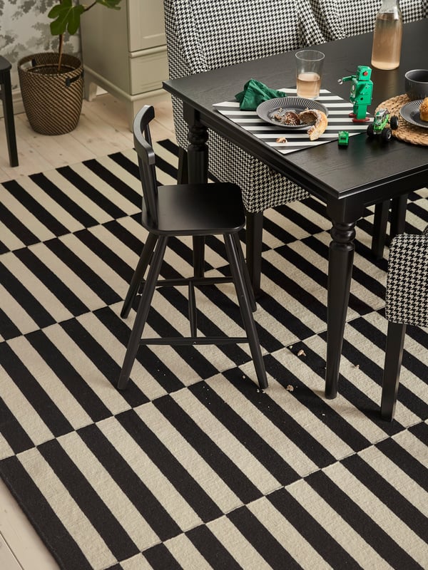 A black INGATORP extendable table in the dining room