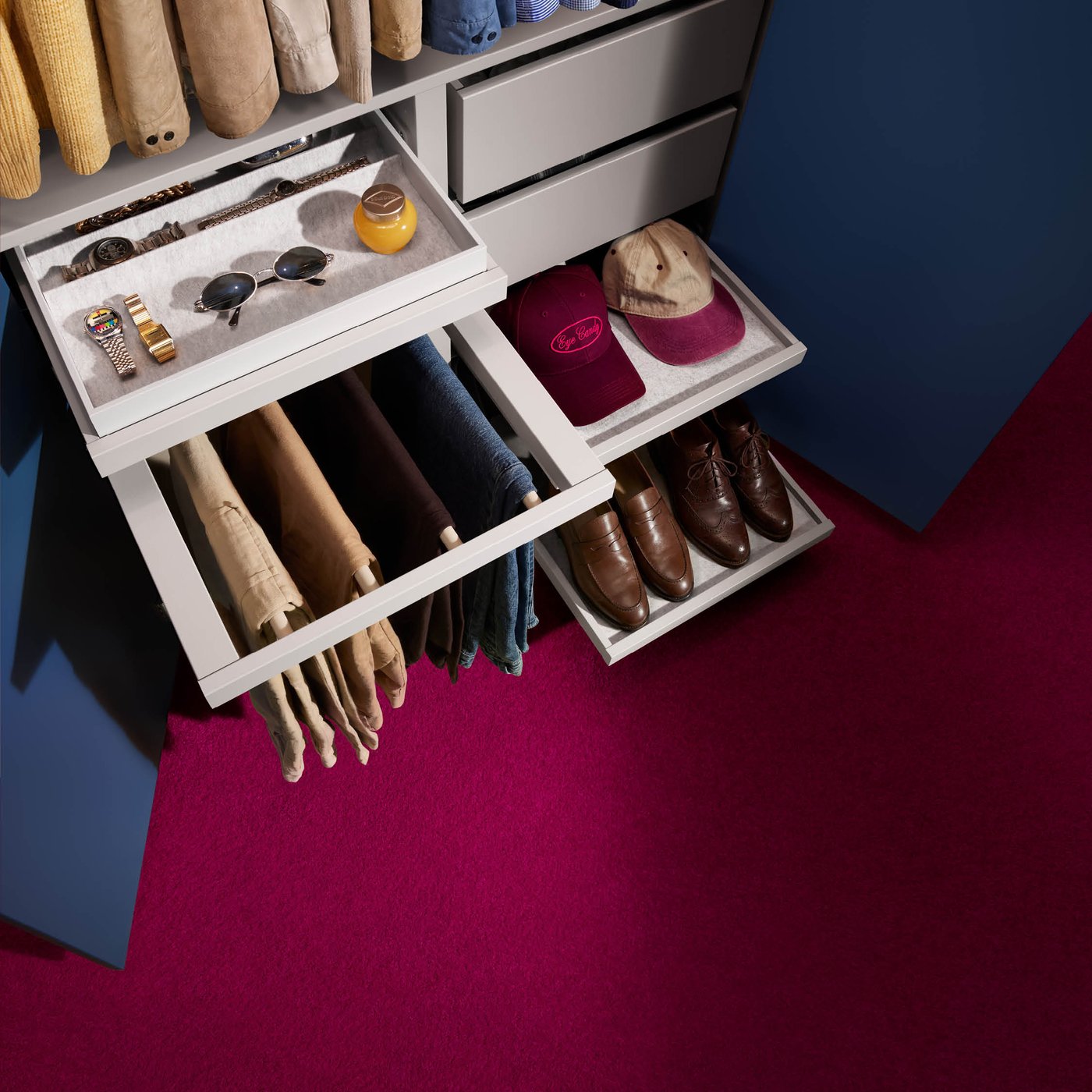 A full PAX wardrobe solution stood in studio lighting, the doors open, showing off the organised interior.