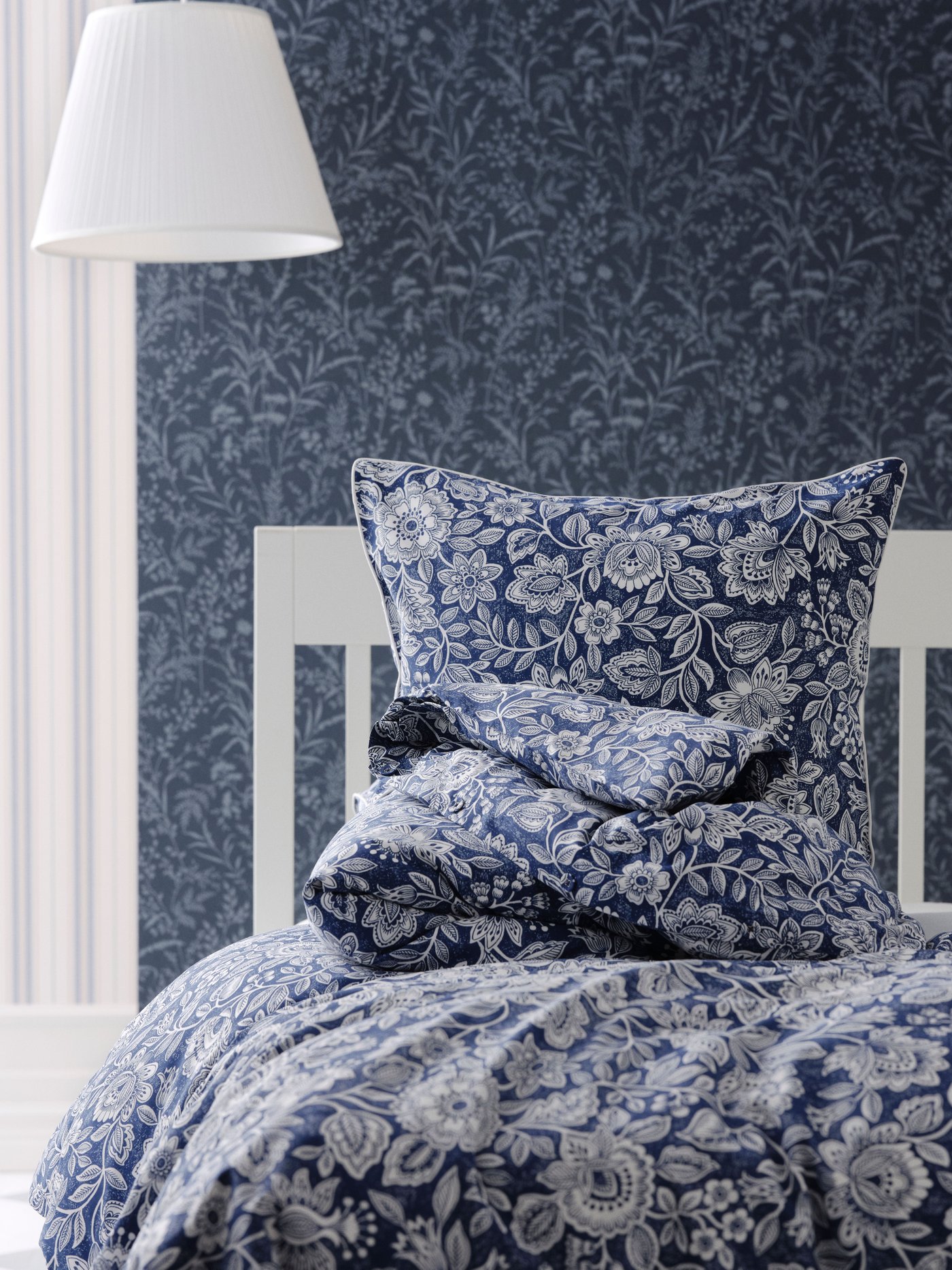 A dark blue/white GLESSTARR duvet cover and pillowcase