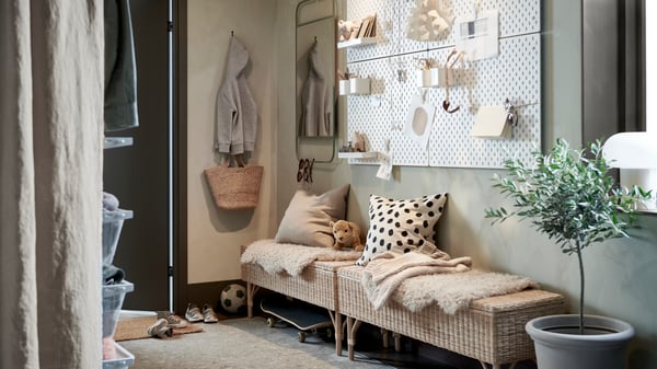A handmade rattan TOLKNING bench with storage