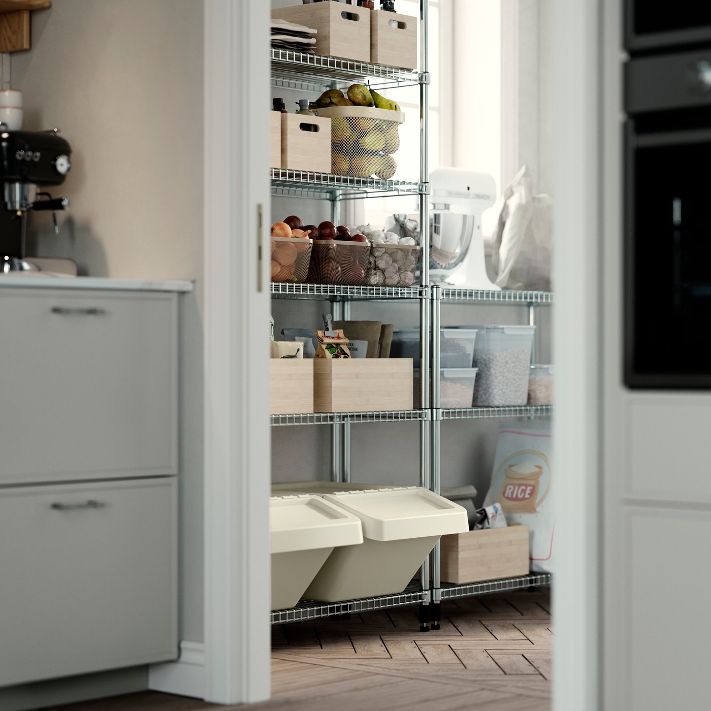 A pantry with OMAR shelving units, storing wooden and plastic boxes, glass jars, fruit baskets, and bags of rice.