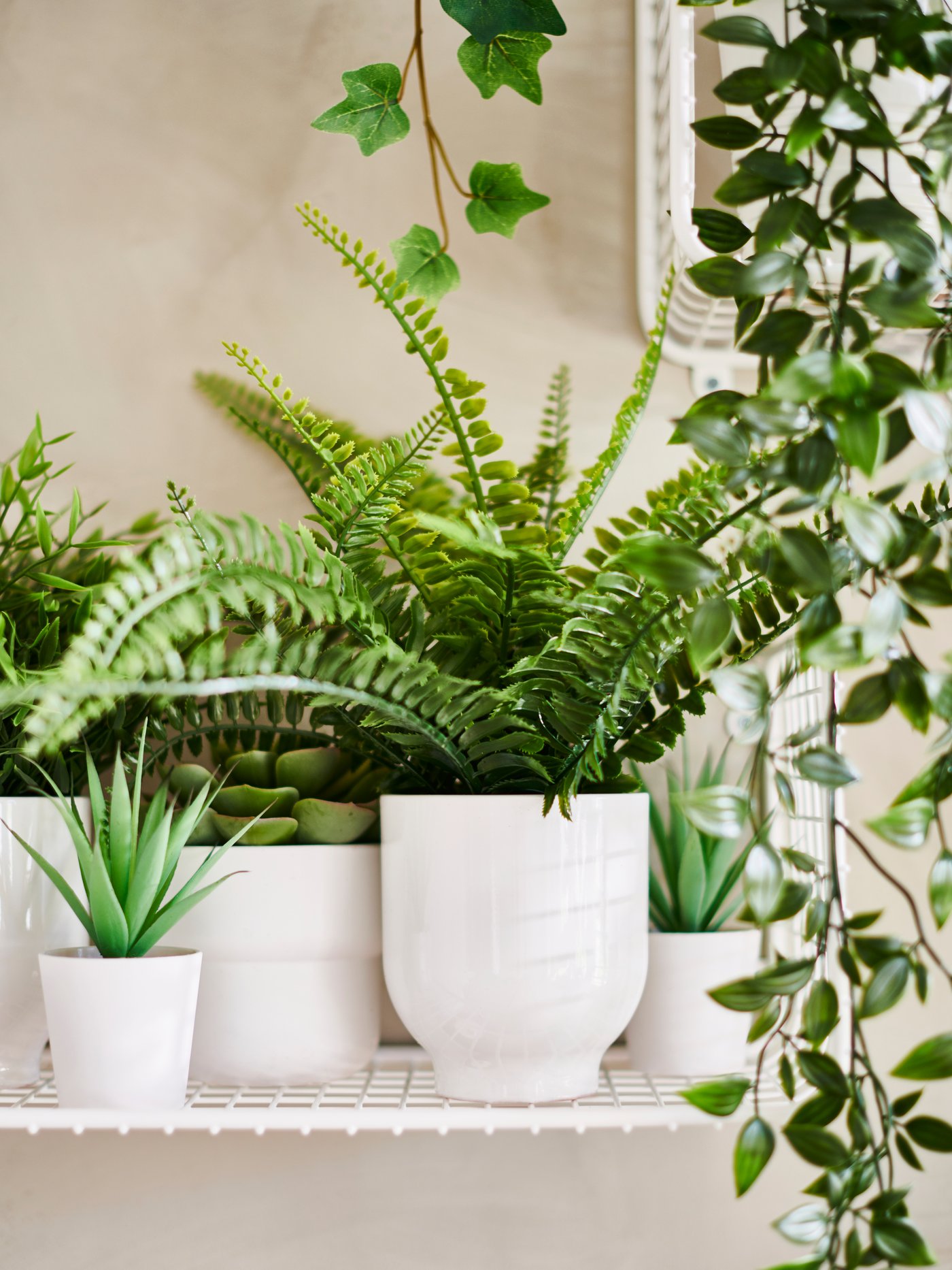 An in/outdoor white FÖRENLIG plant pot in the living room