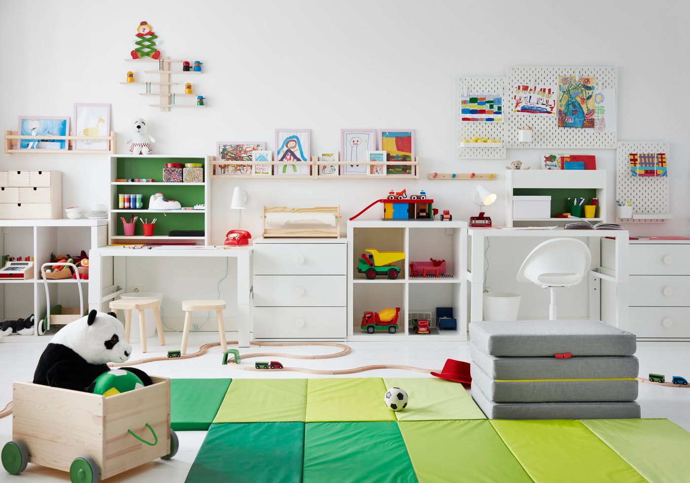 A light white stained pine FLISAT wall storage in the childrens room
