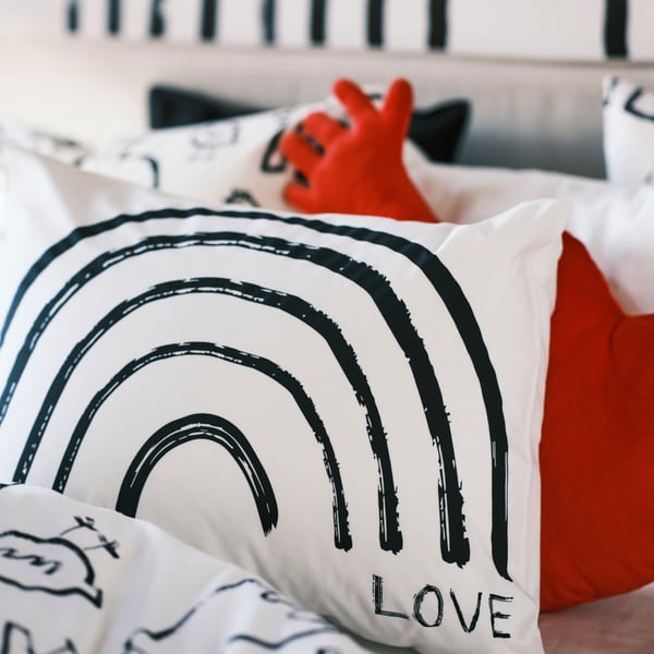 A white/rainbow TAPETMAL pillowcase