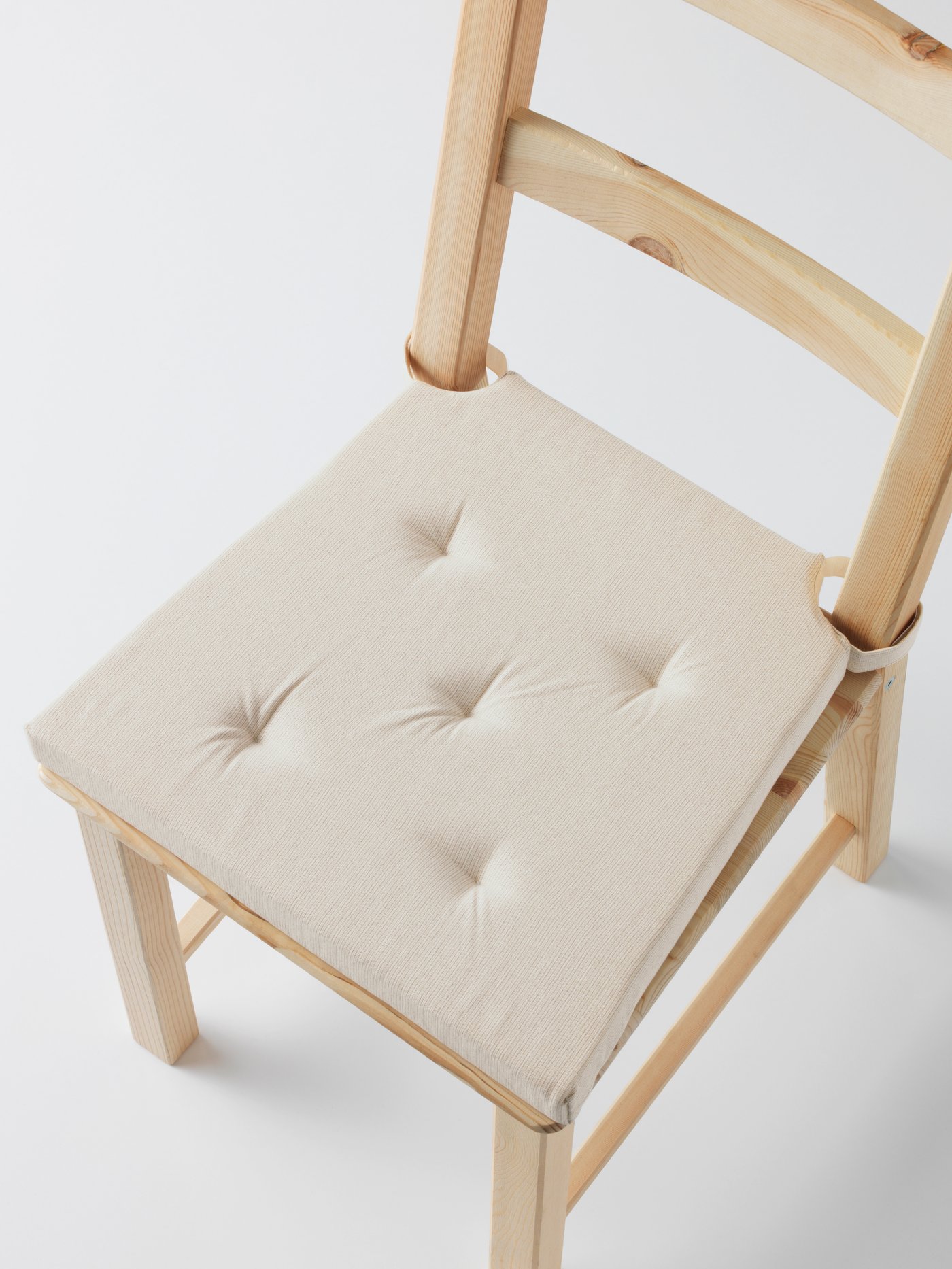 A natural JUSTINA chair pad
