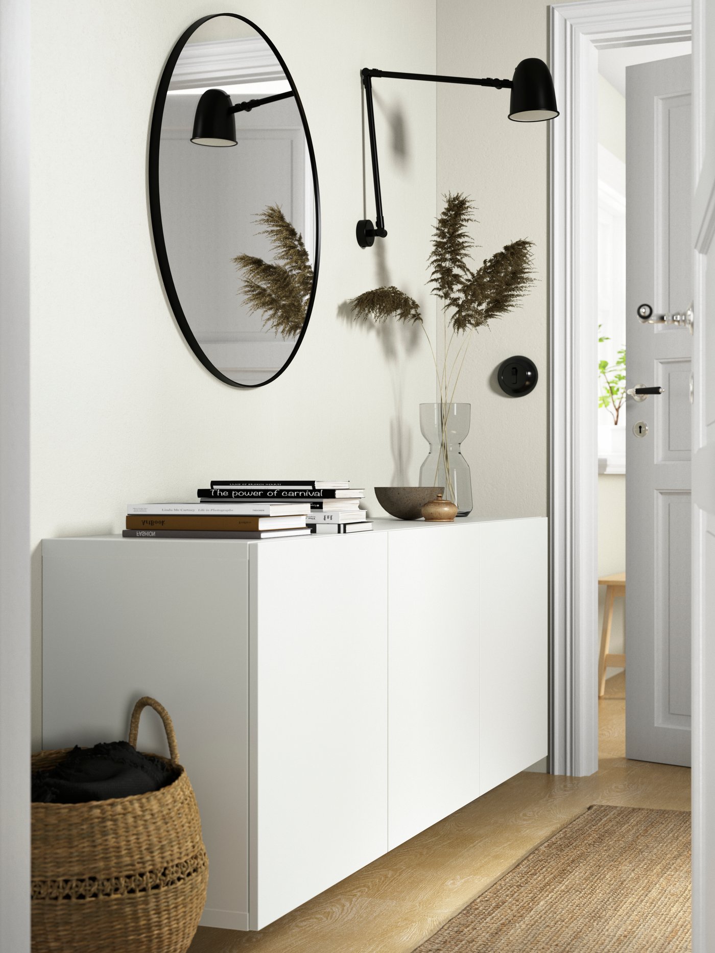 A black SKURUP work/wall lamp in the hallway