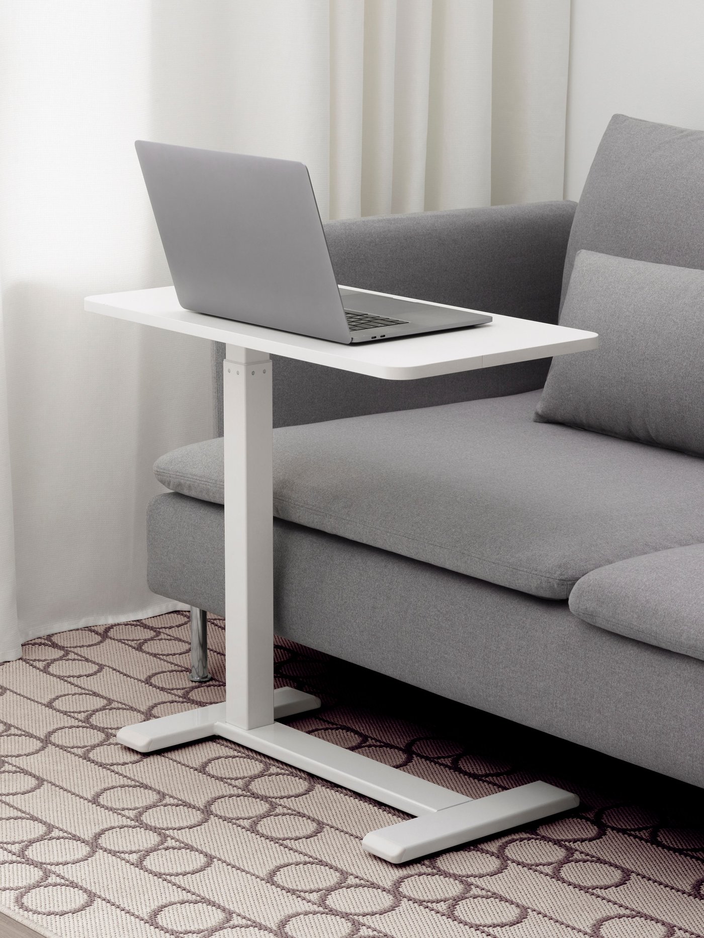 A white BOLLSIDAN laptop stand