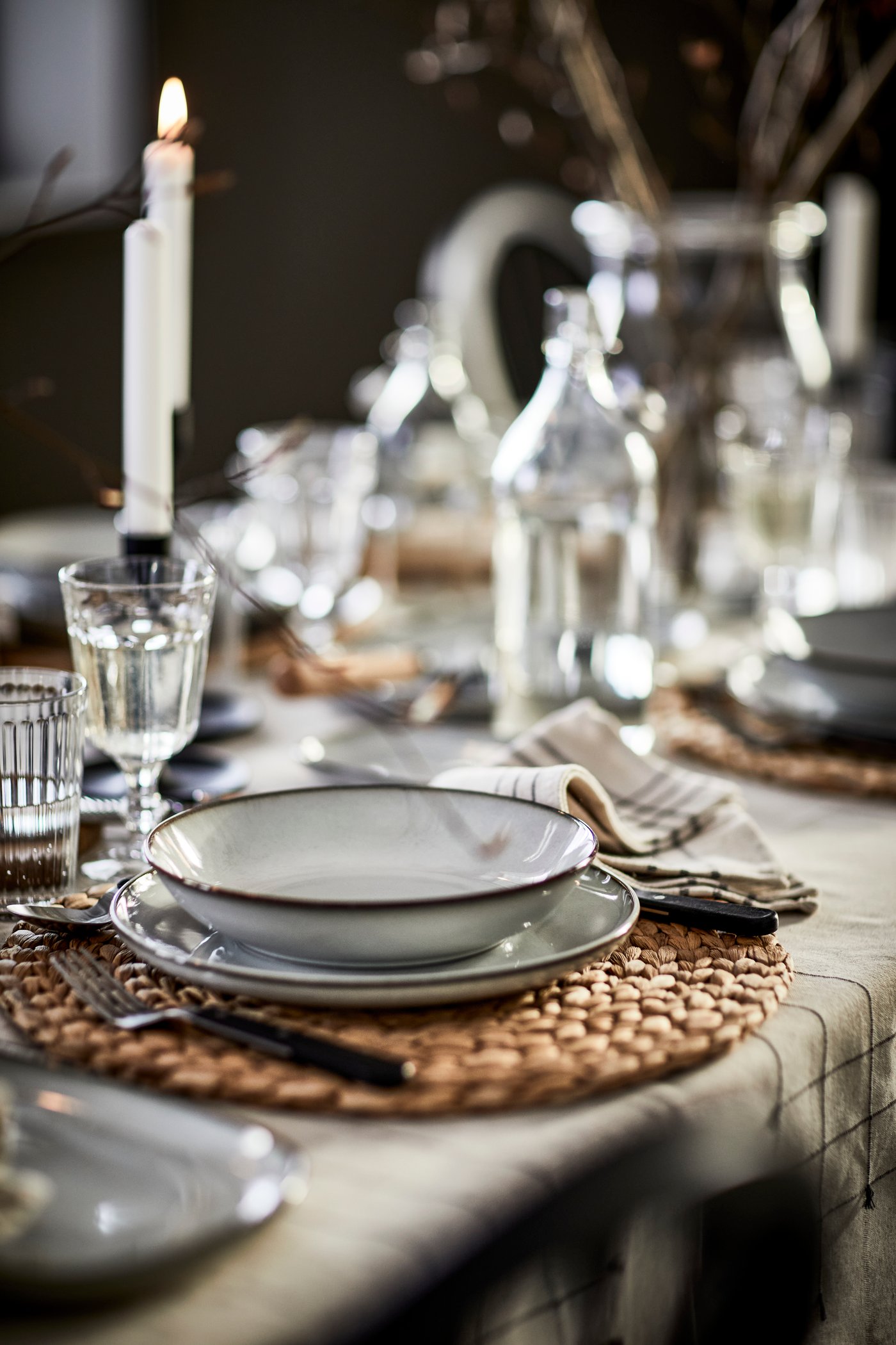A dark grey/natural VÅRARV napkin in the dining room