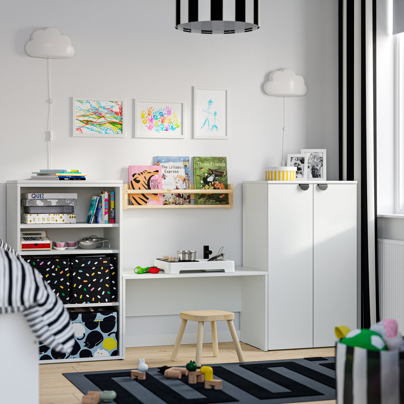 A black/blue SKÅJARE box in the childrens room
