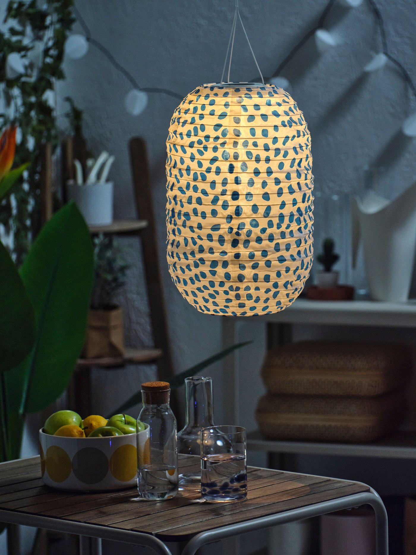 A spotted solar-powered/blue SOLVINDEN pendant lamp
