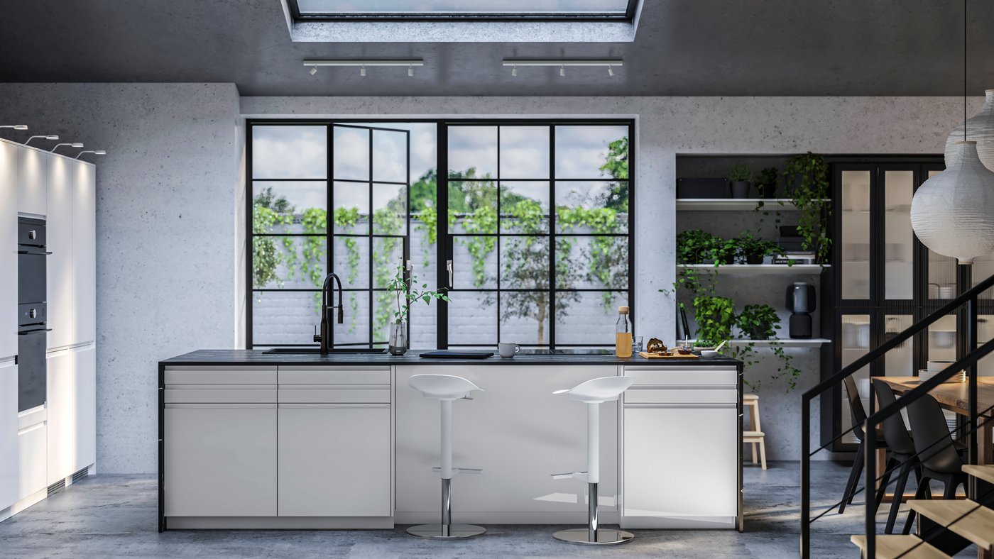 A modern white high-gloss IKEA VOXTORP kitchen with black worktop in a room with large black metal doors going out to the terrace