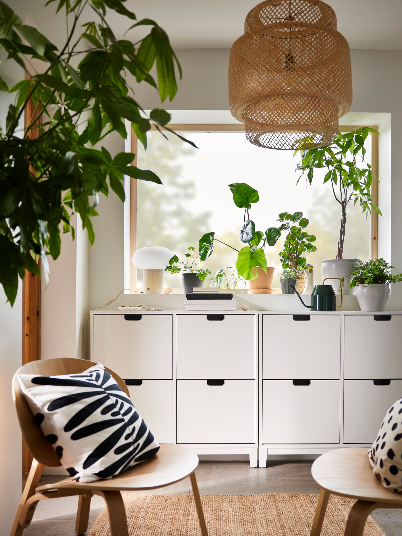 A white STÄLL shoe cabinet with 4 compartments in the hallway