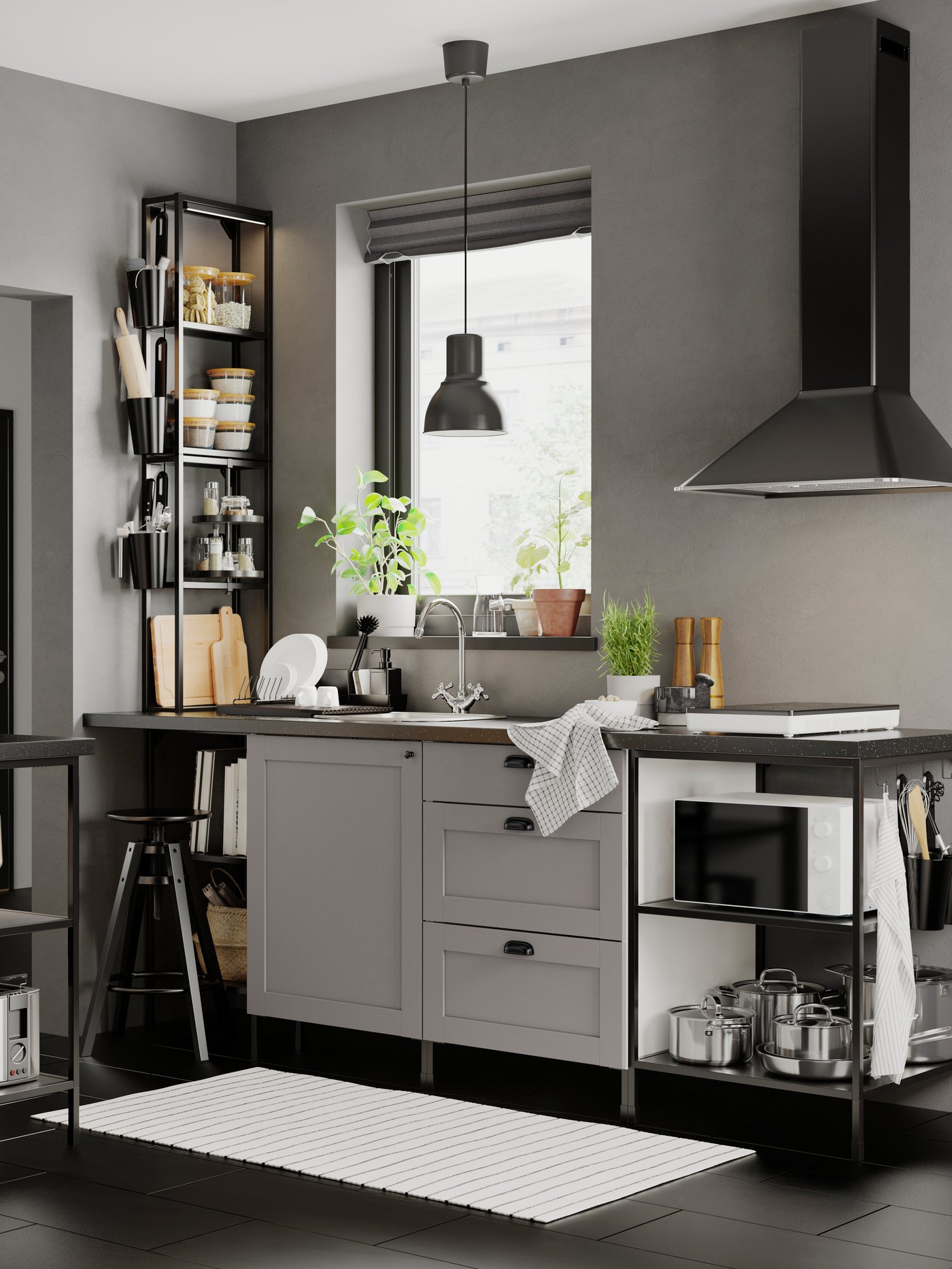 A white/dark grey/patterned RINNIG tea towel