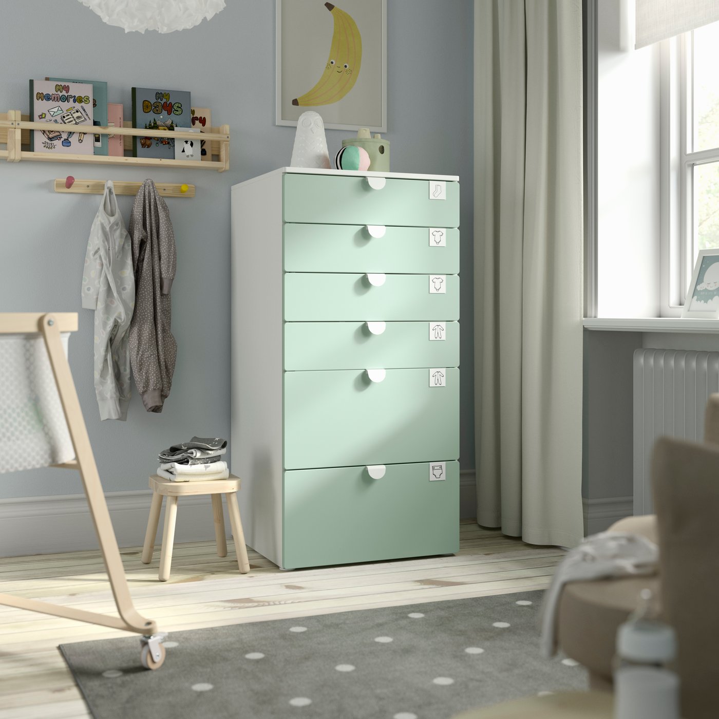 A white/light green PLATSA chest of 6 drawers in the childrens room