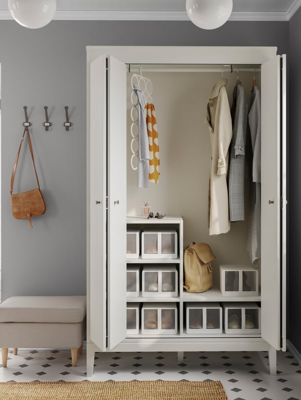 A white cabinet IDANÄS with shoe storages