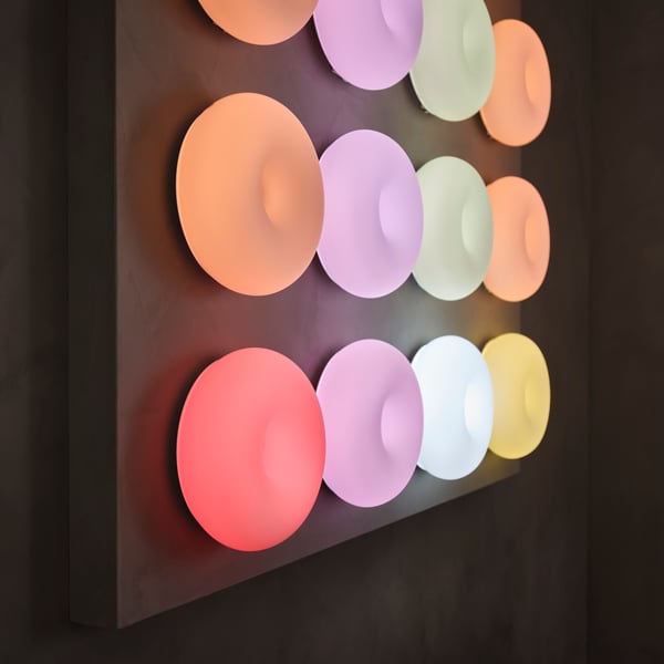 A dimmable smart/white glass colour and white spectrum VARMBLIXT LED table/wall lamp in the NA