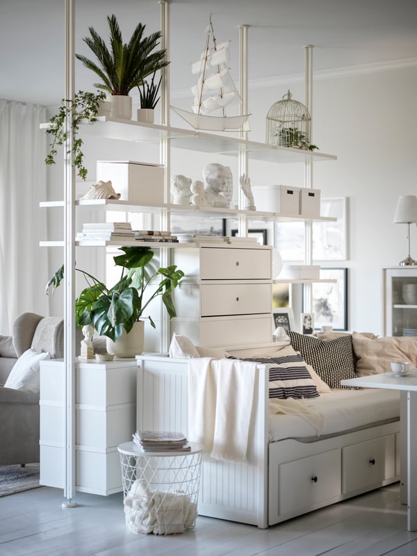 A HEMNES bed and ELVARLI cabinet in a white living room.