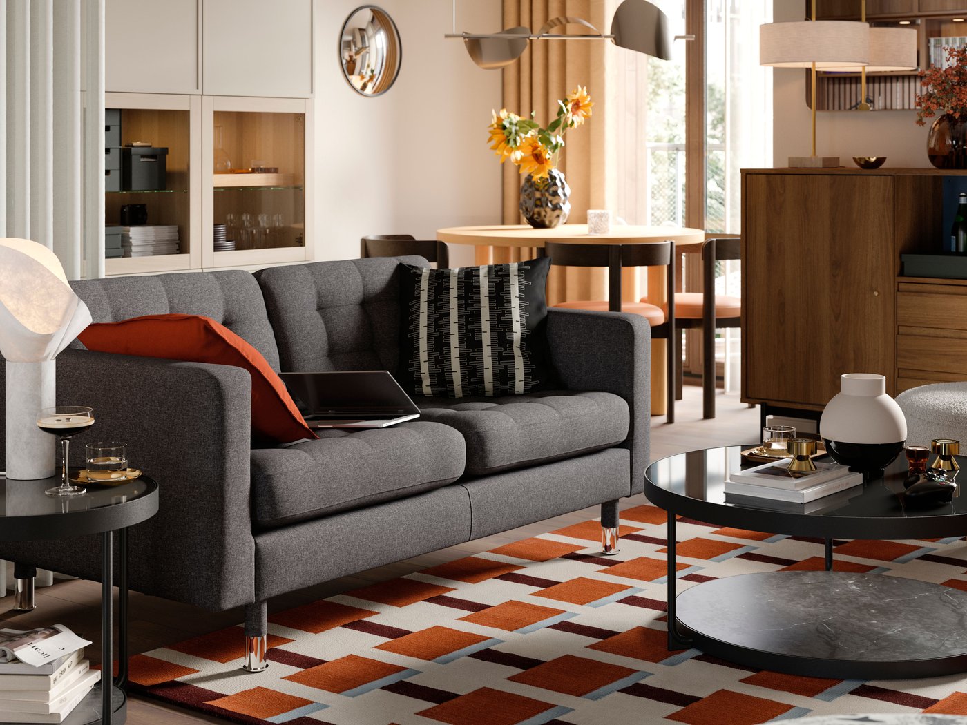 A red-brown DYTÅG cushion cover in the living room
