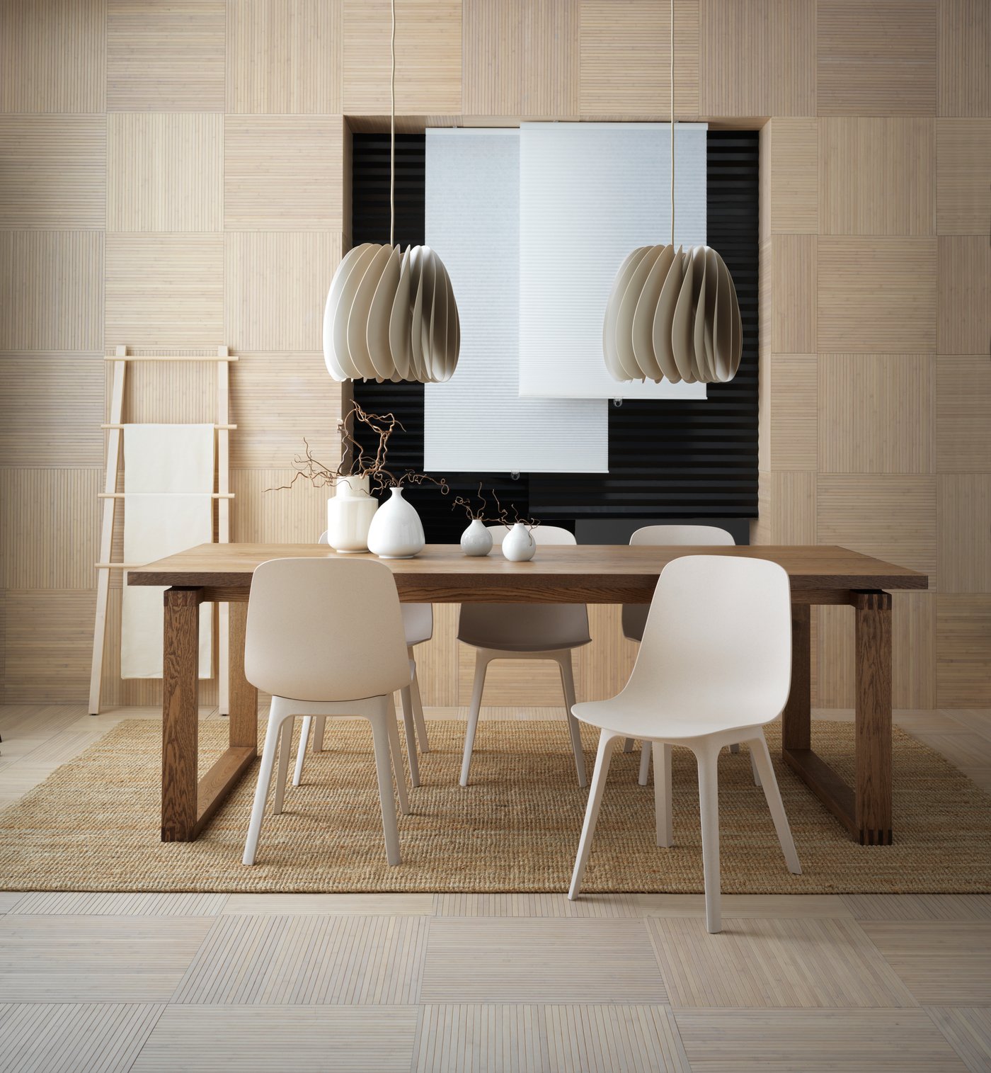 A beige SKYMNINGEN pendant lamp in the dining room